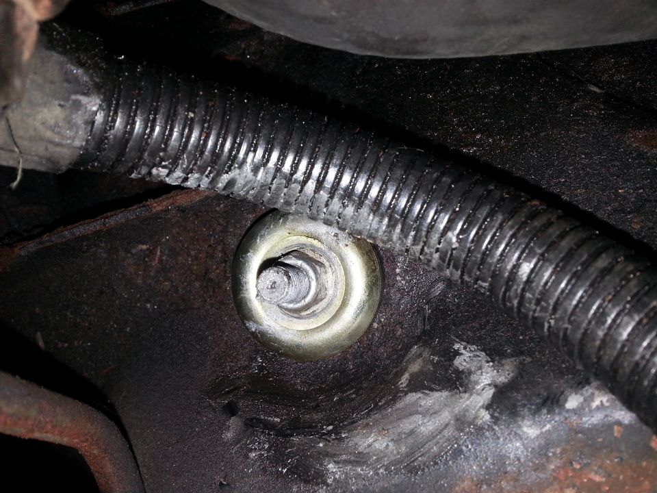 Got the new urethane stem or bayonet bushings installed. Here is the one under the fuel pump on the passengers side. Note the bayonet stud and nyloc nut threads are lathered in anti seize.