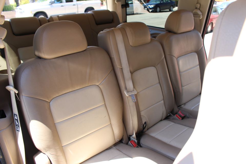 2003 Ford Expedition interior showing tan leather seats in the second and third rows