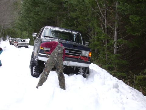 1991 Ford Bronco - A group of Ford Broncos navigate a snowy forest road in January 2004.