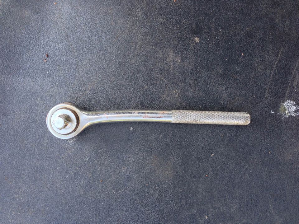 Ratchet wrench on a dark surface