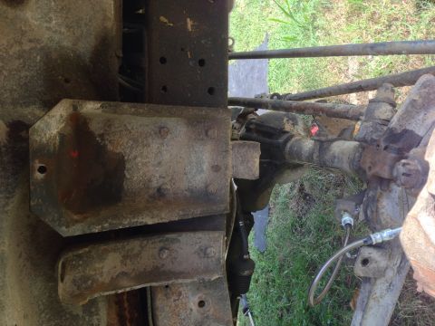 1979 Ford Bronco - Undercarriage view showing the frame and suspension parts of a vehicle.