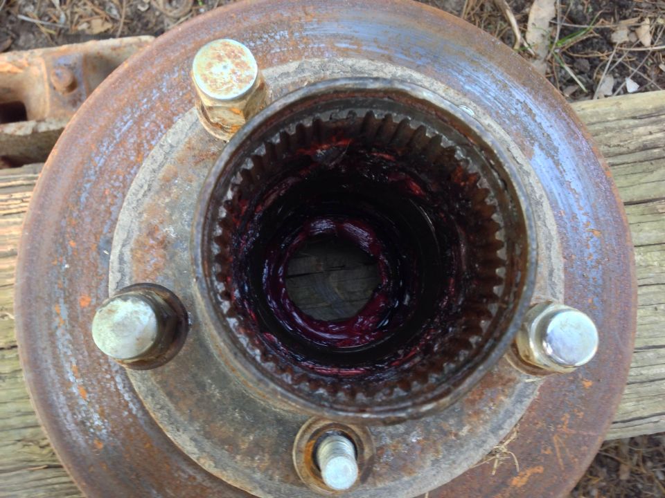 Greased wheel hub with splines and lug bolts