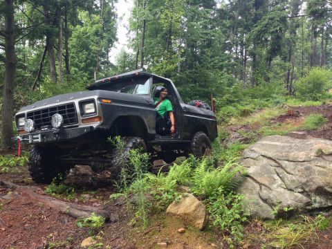 1979 Ford Bronco - This modified 1979 Ford Bronco tackles a challenging off-road course through a dense forest.