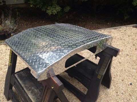1979 Ford Bronco - Diamond plate aluminum panel on sawhorses, with "SUPERMOTORS.NET" watermark visible.