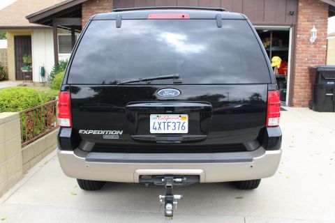 2003 Ford Expedition - Rear view of a black 2003 Ford Expedition parked in a driveway.