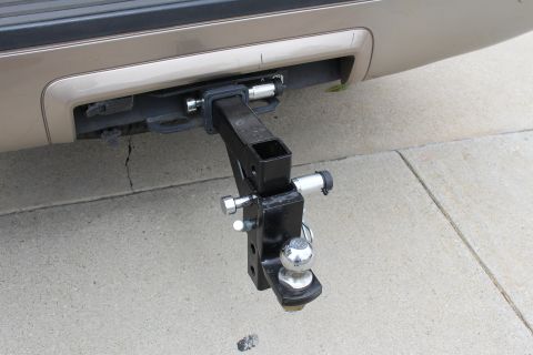 2003 Ford Expedition - Close-up of a trailer hitch assembly mounted on the rear of a vehicle.