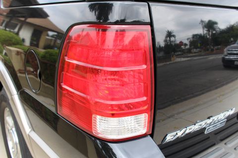 2003 Ford Expedition - Rear view of a black SUV showing the taillight and Expedition badging.