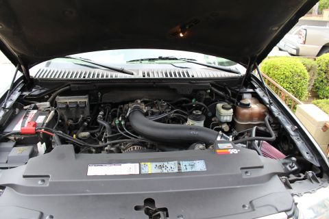 2003 Ford Expedition - The engine bay features a K&N air intake system, visible under the open hood.