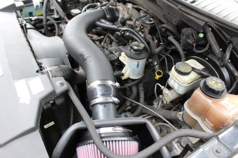2003 Ford Expedition - Close-up of engine bay with aftermarket K&N air intake installed.