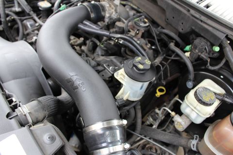 2003 Ford Expedition - Engine bay detail a K&N air intake system and other engine components.