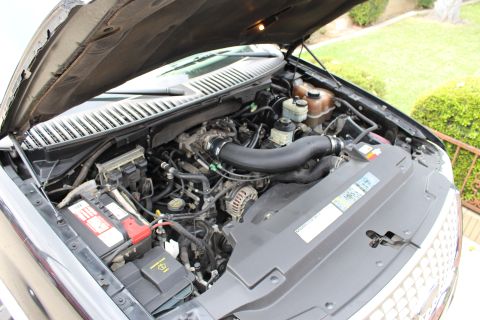 2003 Ford Expedition - The engine bay of a 2003 Ford Expedition is shown with the hood open.