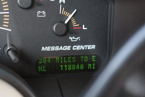 2003 Ford Expedition - Close-up of a vehicle's dashboard gauges, showing fuel range and odometer readings.