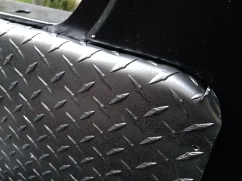 1979 Ford Bronco - Diamond plate metal texture is visible on a black surface, with a Supermotors.net watermark in the corner.