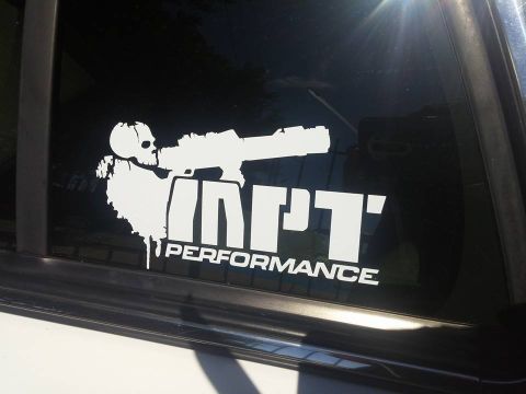 2000 Mercury Grand Marquis - A "NPT PERFORMANCE" sticker a skull aiming a rifle is applied to the window of a vehicle.