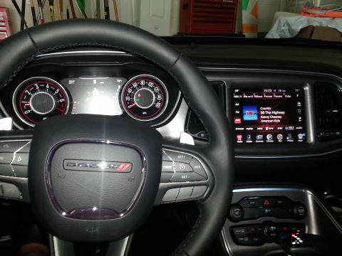 2015 Dodge Challenger - Interior view of a 2015 Dodge Challenger, the steering wheel and central display.