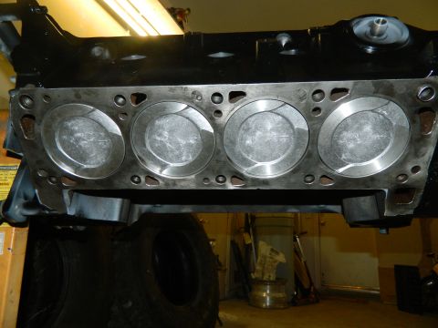 1979 Ford Bronco - Close-up view of an engine block with pistons exposed, likely during a rebuild or inspection.