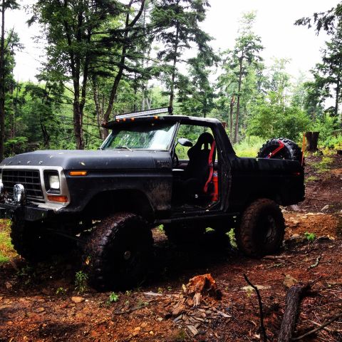 1979 Ford Bronco - This modified Ford Bronco is equipped for off-road adventures in a forest setting.