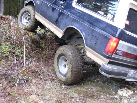 1991 Ford Bronco - This 1991 Ford Bronco is shown off-roading on a steep, rocky incline.