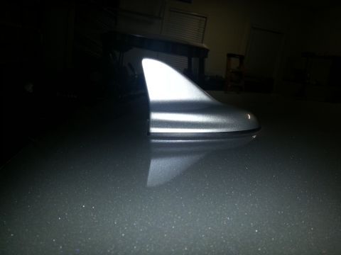 2015 Dodge Challenger - A close-up of a shark fin antenna mounted on the roof of a vehicle.