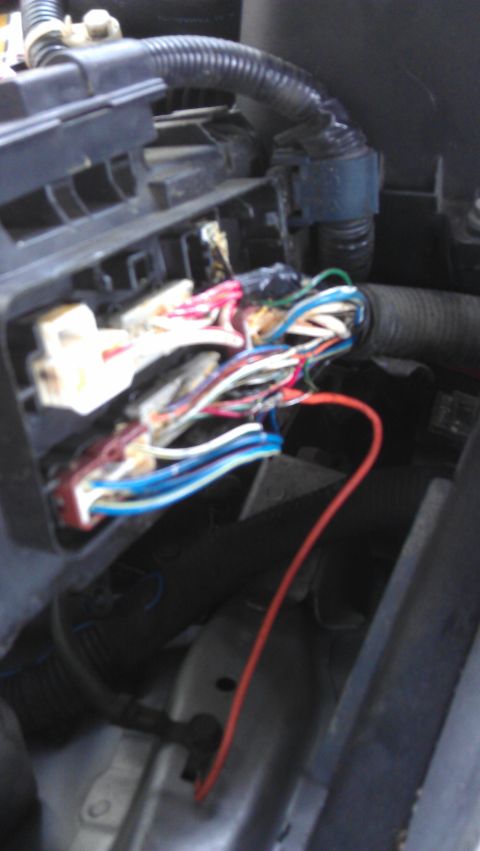 1994 Ford Bronco - A complex engine wiring harness with many colorful wires and exposed connectors is visible.