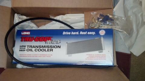 2003 Ford Crown Victoria - Long Tru-Cool Max low-pressure-drop transmission oil cooler with hose sits in its opened printed shipping box.