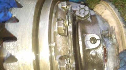 1979 Ford Bronco - Close-up view of a greasy differential part with visible gears and bolts.