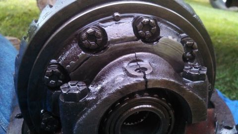 1979 Ford Bronco - A close-up view of a damaged differential housing, showing a prominent crack.
