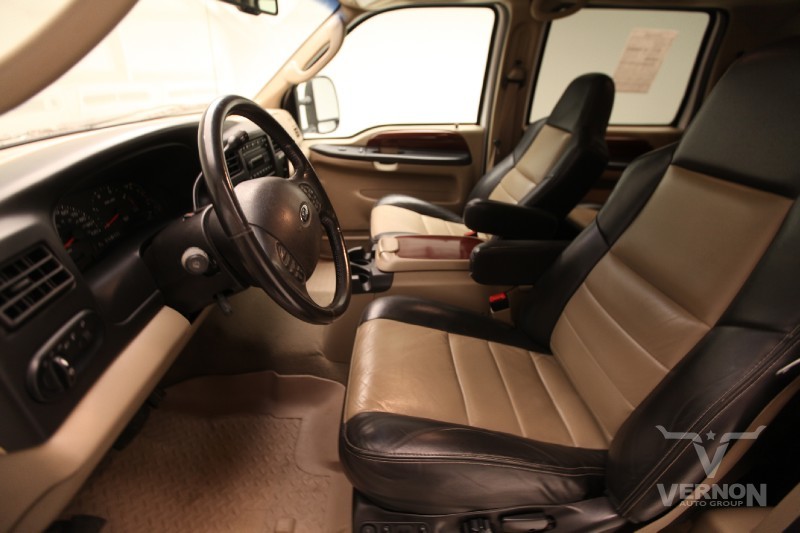 2005 Ford Excursion interior showing two-tone leather seats, steering wheel, and dashboard