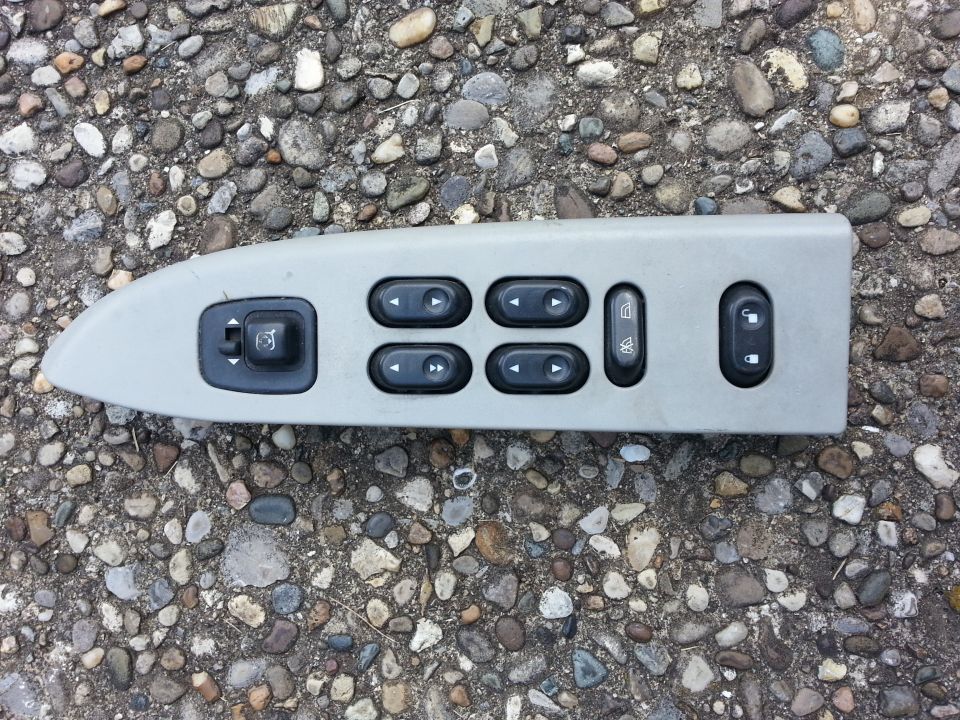 Car door control panel with window and mirror buttons