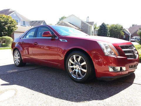 2008 Cadillac CTS - This red 2008 Cadillac CTS is shown from the front three-quarter angle.