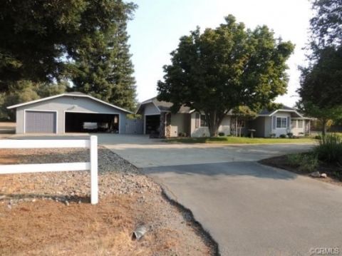 House with attached garage and detached garage. Driveway in front