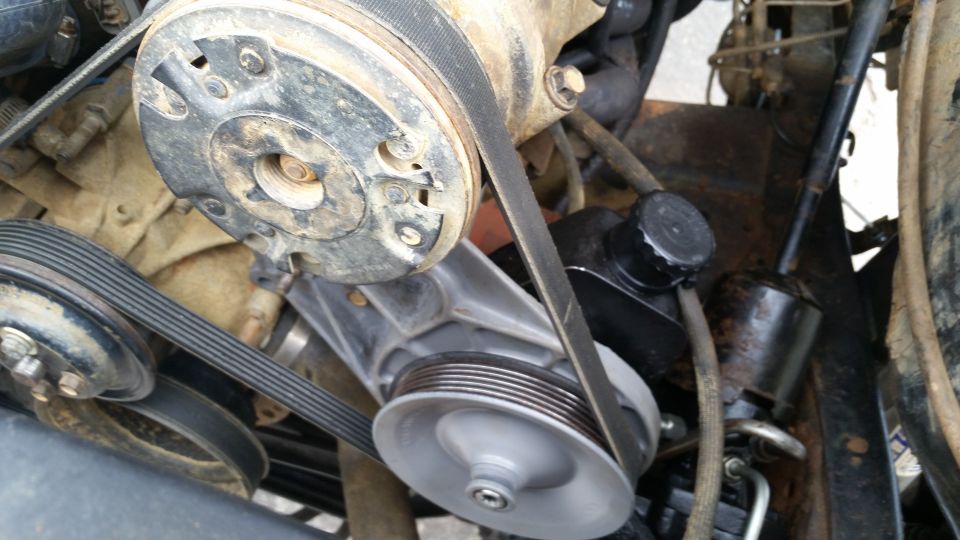 Engine pulleys and belts with a power steering pump