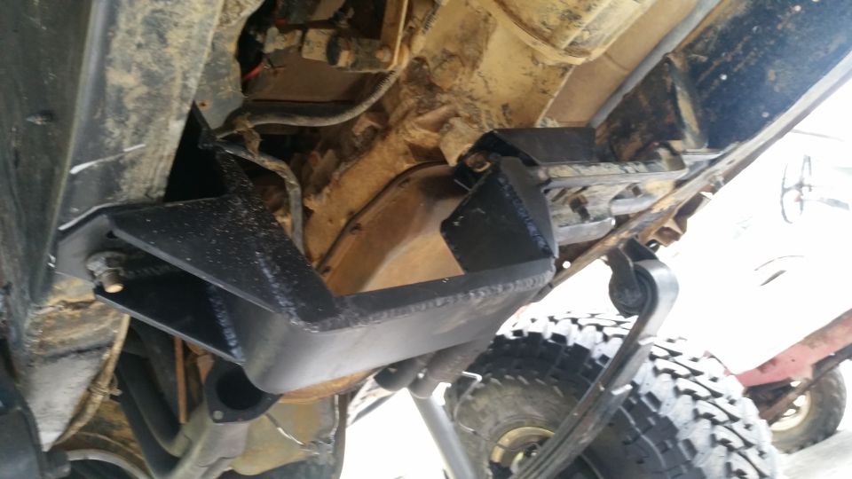 Underbody skid plates and suspension components