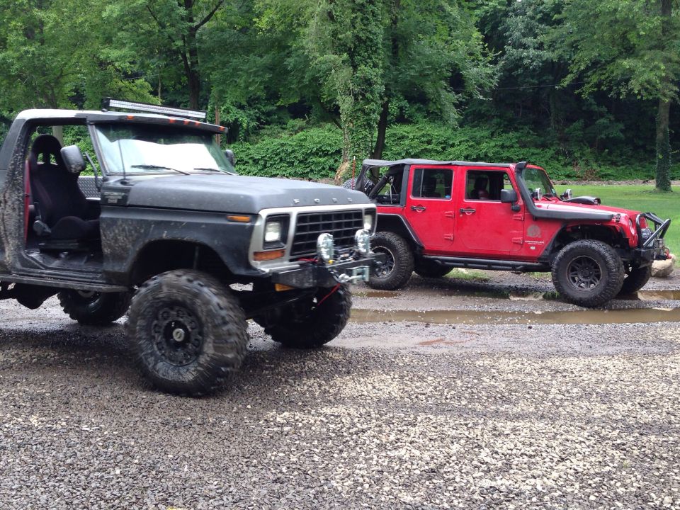 Black 1978 Ford Bronco with lifted suspension and off-road tires, doors removed