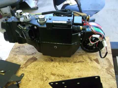 1967 Ford Mustang - This is an automotive air conditioning unit with chrome knobs and a visible wiring harness.