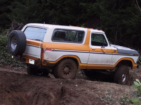 1991 Ford Bronco - This 1978 Ford Bronco is navigating a muddy off-road trail.