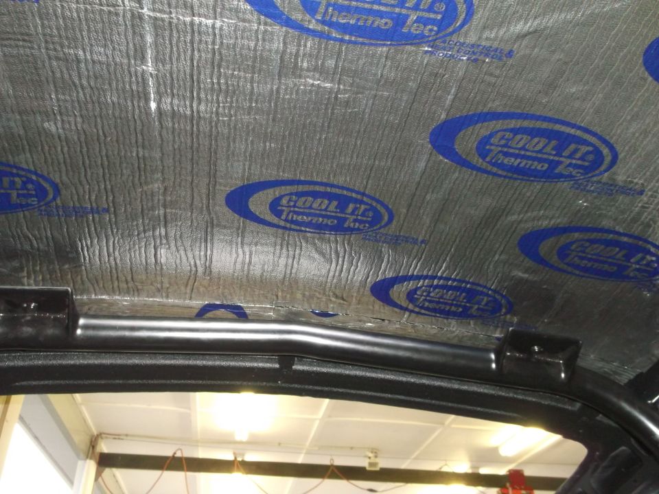 Insulated roof & Shelby rollbar.