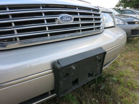 1991 Ford LTD Crown Victoria - Front view of a silver Ford Crown Victoria, showing the grille and Ford emblem.