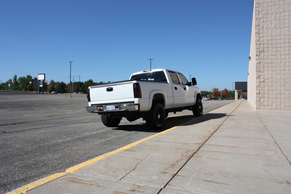 2006 Chevrolet Silverado 2500 pickup truck parked in a lot, rear view