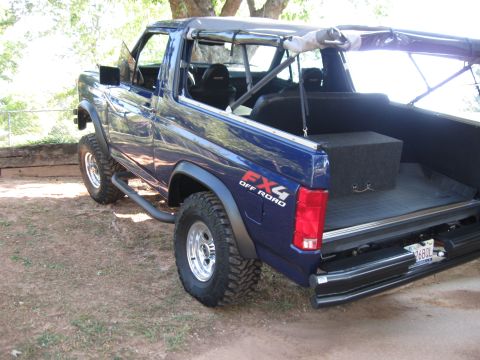 1982 Ford Bronco - This blue 1982 Ford Bronco features an FX4 Off Road decal and a removable soft top.
