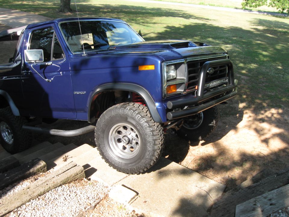 1982 Ford Bronco, blue, with aftermarket bull bar and LED light bar