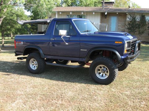 1982 Ford Bronco - This modified Ford Bronco features a removable soft top and a lifted suspension.