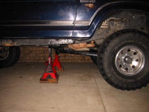 1985 Ford Bronco - This 1985 Ford Bronco is shown on jack stands, highlighting its side profile and suspension components.
