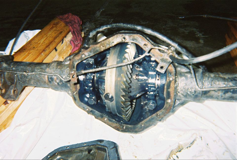 Rear axle with differential cover removed, exposing ring gear and carrier