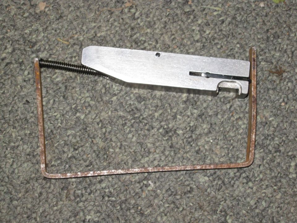 Metal part with spring and wire frame