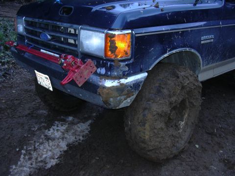 1991 Ford Bronco - Muddy 1987 Ford Bronco front end with a Hi-Lift jack mounted on the bumper.