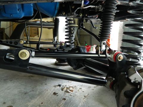 1979 Ford Bronco - Close-up view of the undercarriage suspension system, showing new axles and shocks.