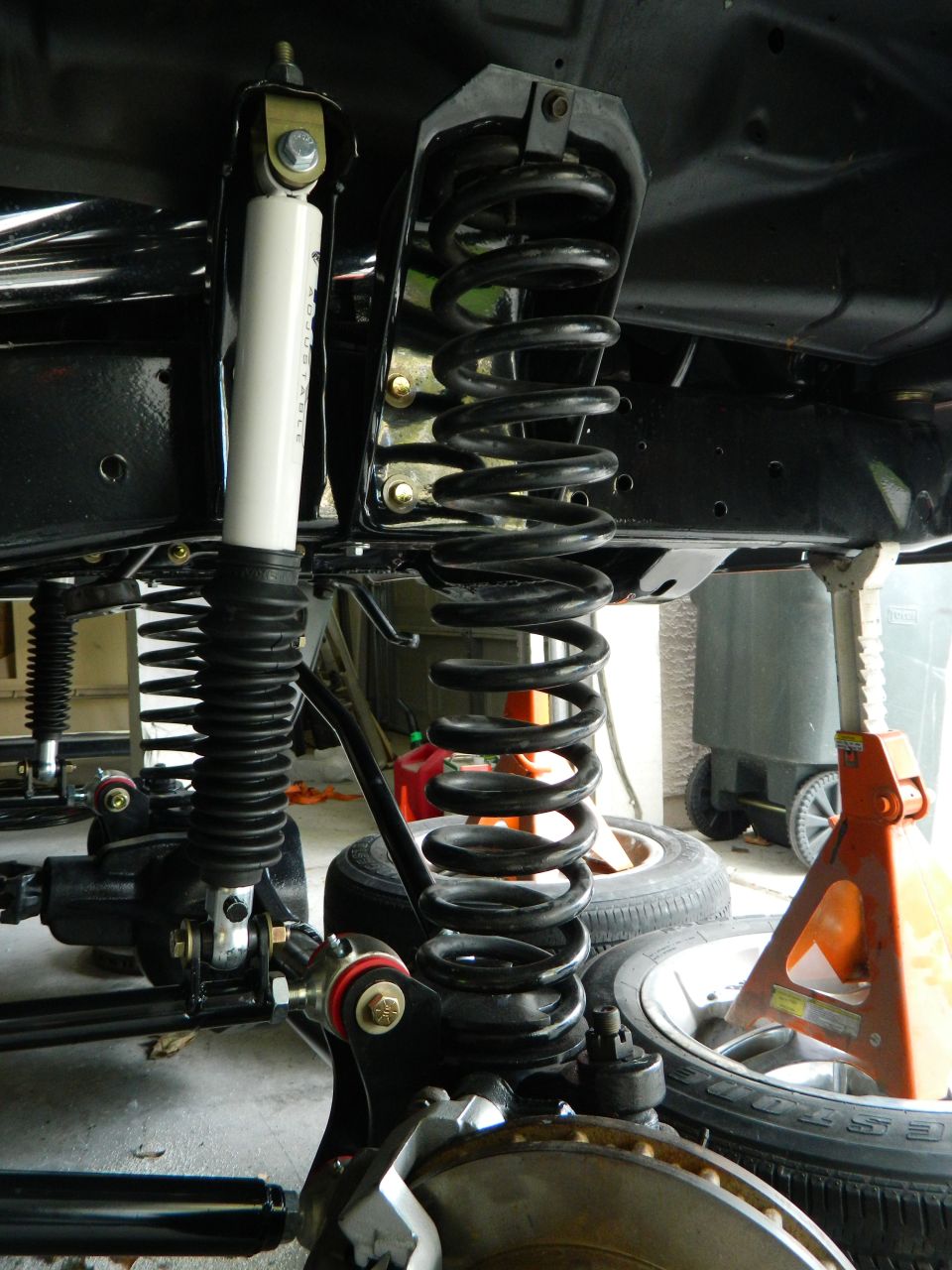 Front suspension with coil springs and white shock absorbers