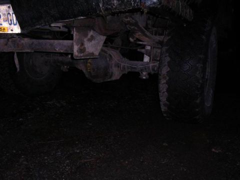 1990 Ford F-150 - Rear axle and tire assembly of a truck, with a visible license plate.