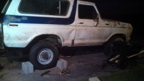 1979 Ford Bronco - This 1978 Ford Bronco shows significant wear and tear, with visible rust and dents along its body panels.